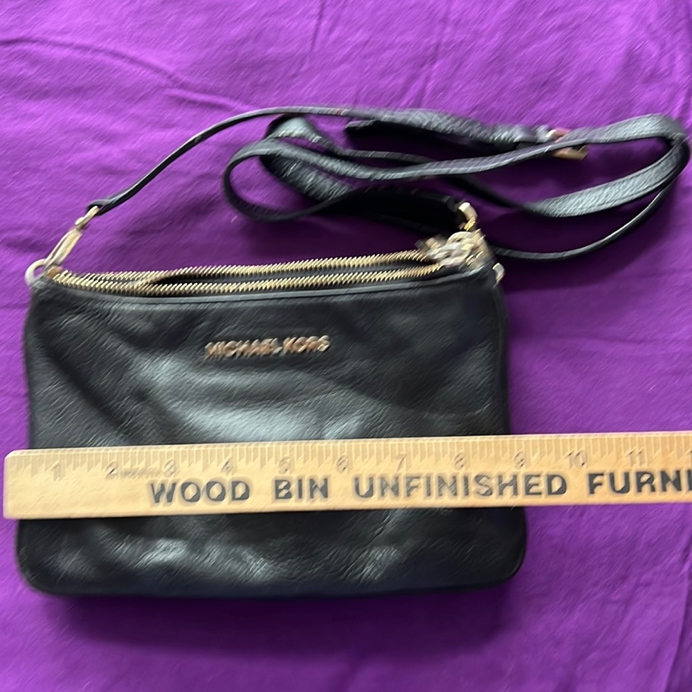 Michael Kors tri-zippered crossbody purse.